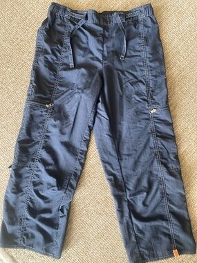 Lucy Navy pants with Orange Logo Tab